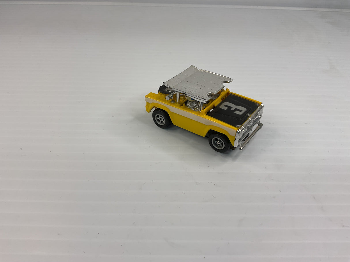 Aurora AFX non-magnatraction Ford Baja Bronco Yellow/Black/White #3 | 1769 | Aurora - AFX