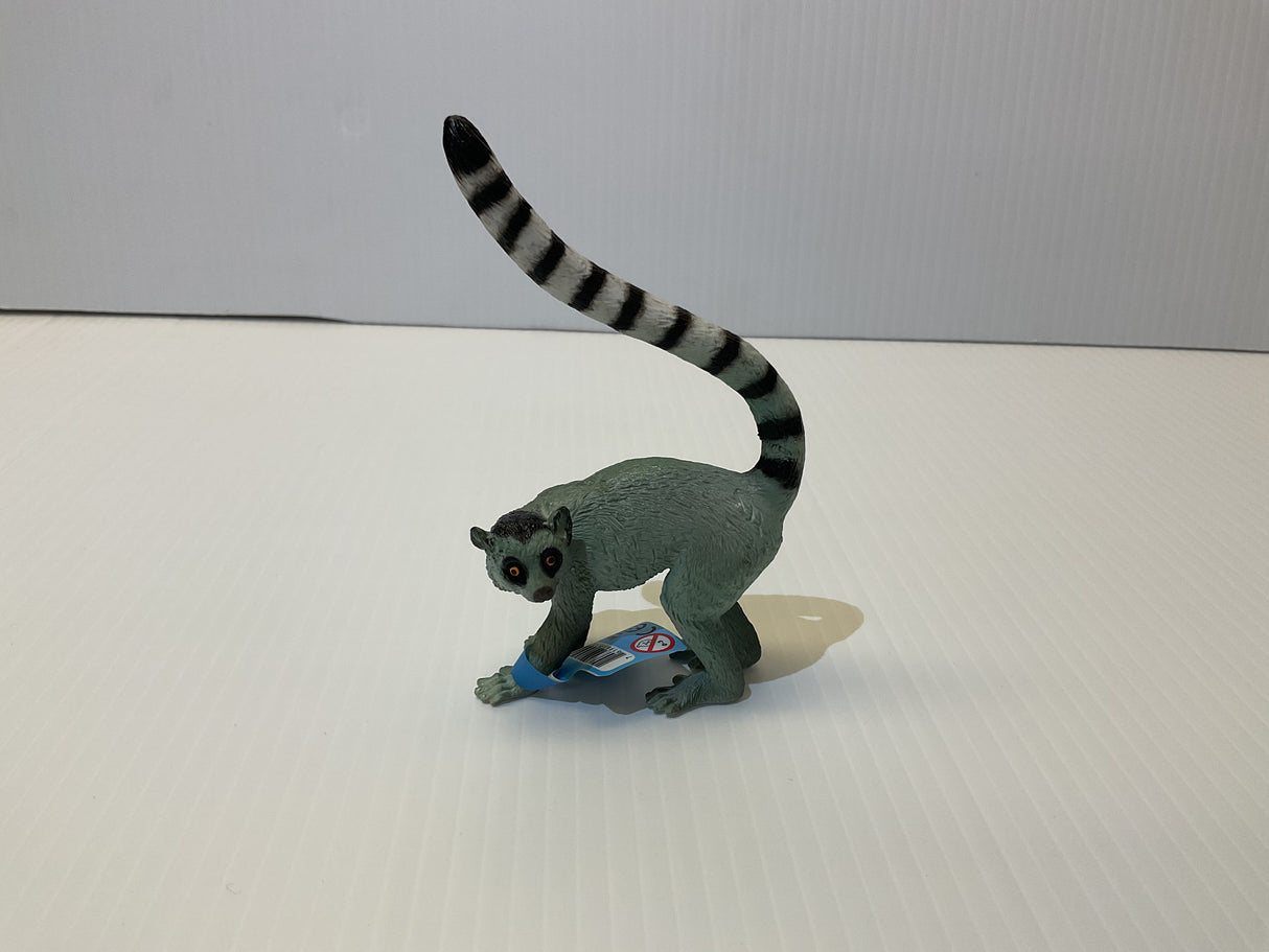 Grey lemur toy with striped tail, standing on a white surface for Mamejo MAJ55028