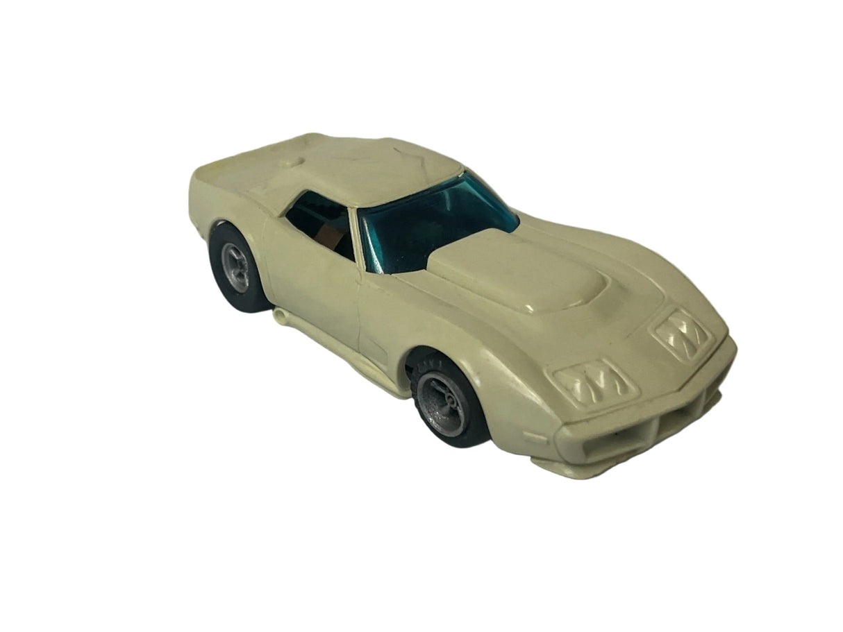 Aurora AFX non-magnatraction Corvette, a production, one piece, stripped, white | 1927 | Aurora - AFX