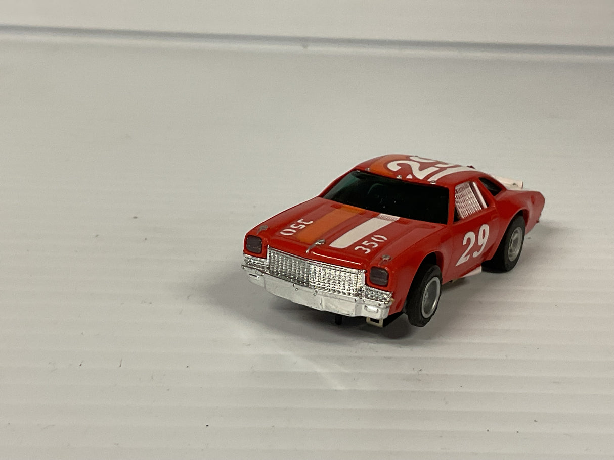 Aurora AFX non-magnatraction lighted Chevelle Stocker red/white/orange #29 | 1975 | Aurora - AFX