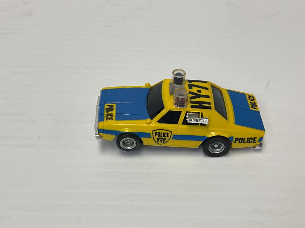 Aurora AFX maga-traction Chevy pursuit car with overhead roof lights blue, and yellow | 1979 | Aurora - AFX