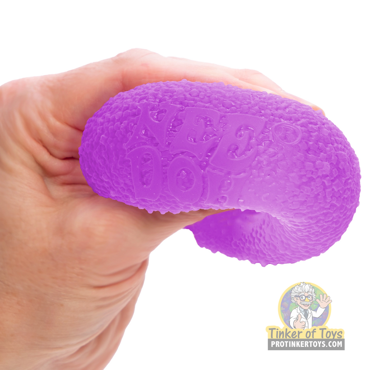 Purple, textured fidget toy held in a hand for Schylling GDND