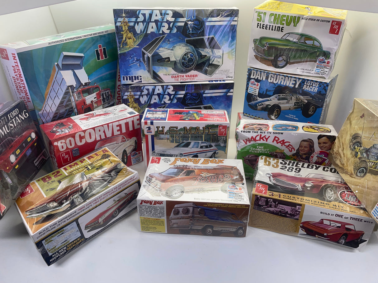 Model kit box art showing a rear-engine dragster race car for AMT AMT1282