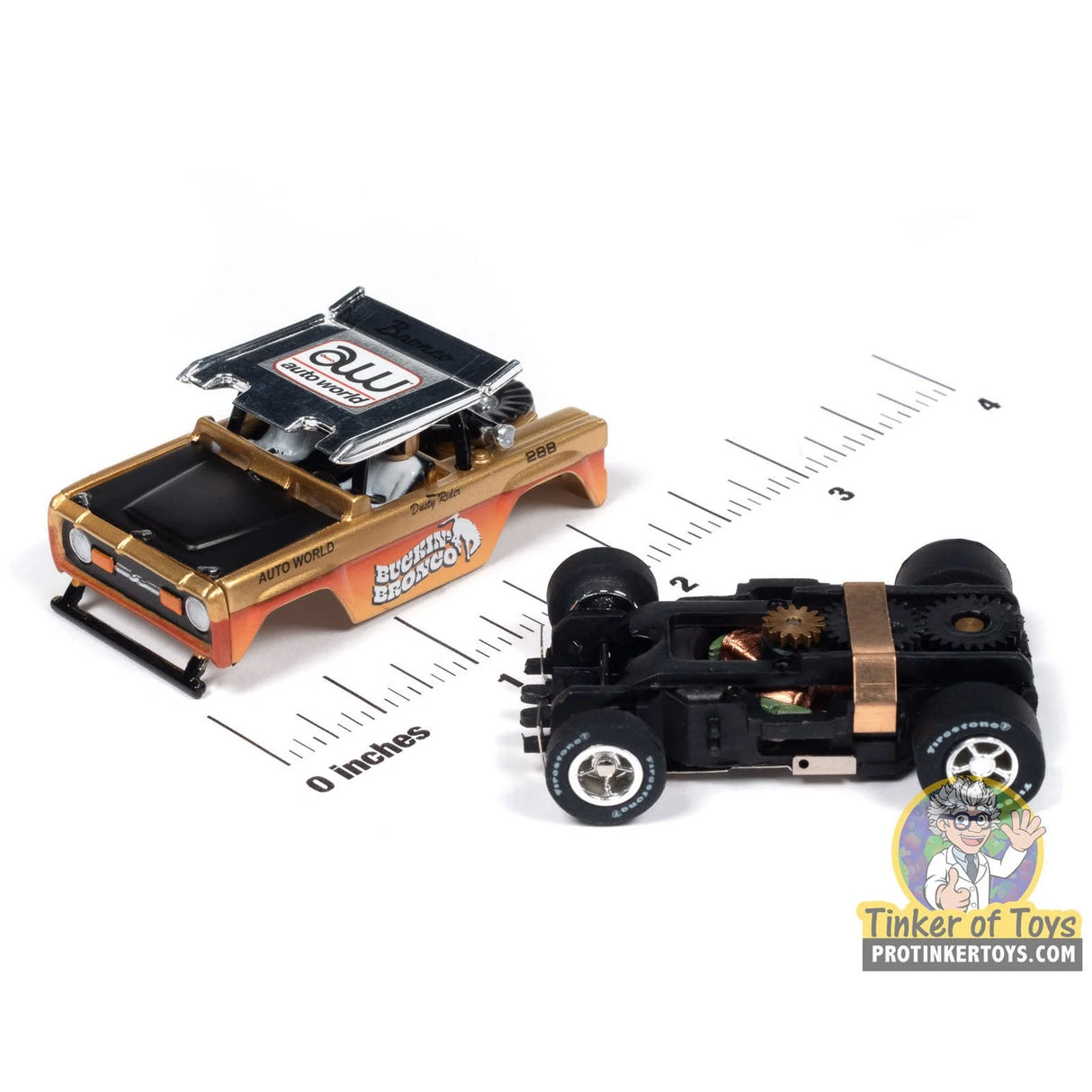 Xtraction 1972 Ford Baja Bronco (Gold with Orange Race Graphics) 1A | SC407 | Auto World — chassis and scale view