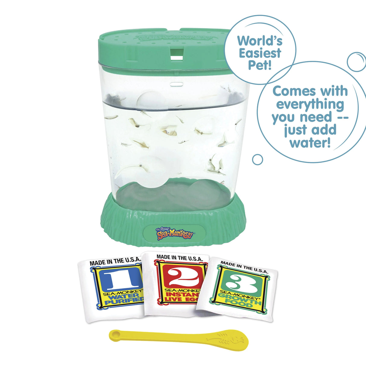 A teal aquarium is filled with water and Sea-Monkeys. Laying in front, there are three packets, numbered 1, 2, and 3 from