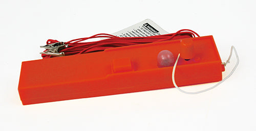 Red launch controller with attached wires and safety warning label for Estes EST2222