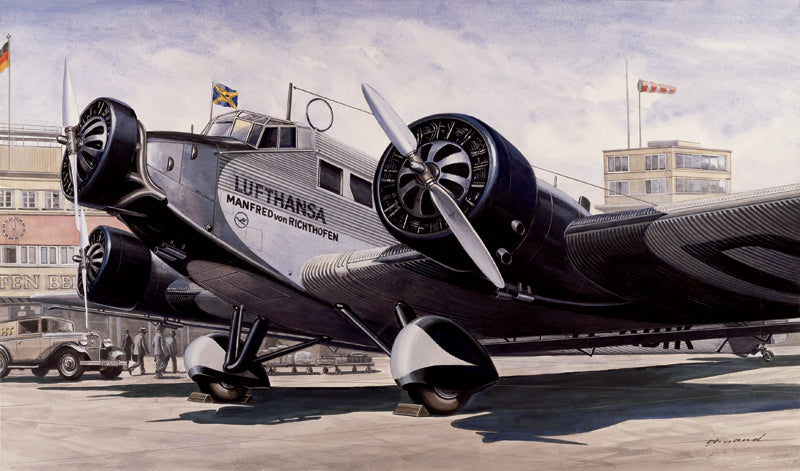 Lufthansa Junkers Ju-52 aircraft model on a tarmac with buildings in background for Italeri 150