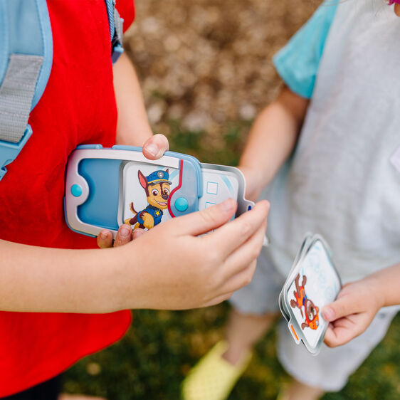 Kids playing with PAW Patrol pup pack role-play toys outdoors for Melissa and Doug 33271