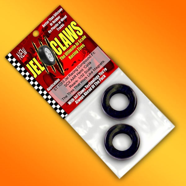 Two black, rubber slot car tires in a red and black package for 2 Tires Jel Claws