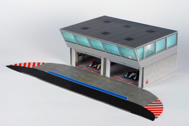 Scale model pit building with garage bays and pit lane area for AFX RaceMaster 1070