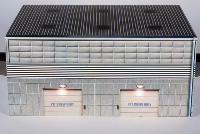 Scale model of a pit building with "PIT CREW ONLY" signs for AFX RaceMaster 1070