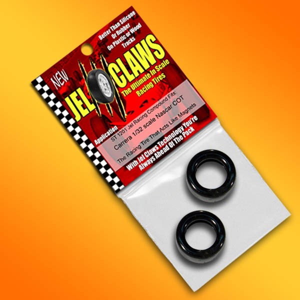 Two black, miniature slot car tires on a red and black package for 2 Tires Jel Claws