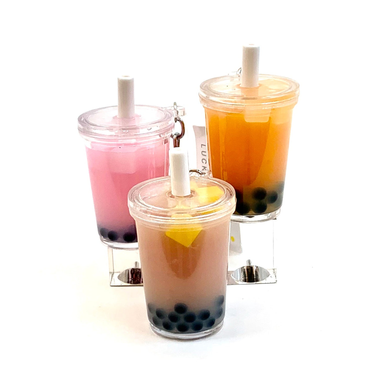 Three boba tea keychains with pink, orange, and brown layered drinks for BC Mini 12032