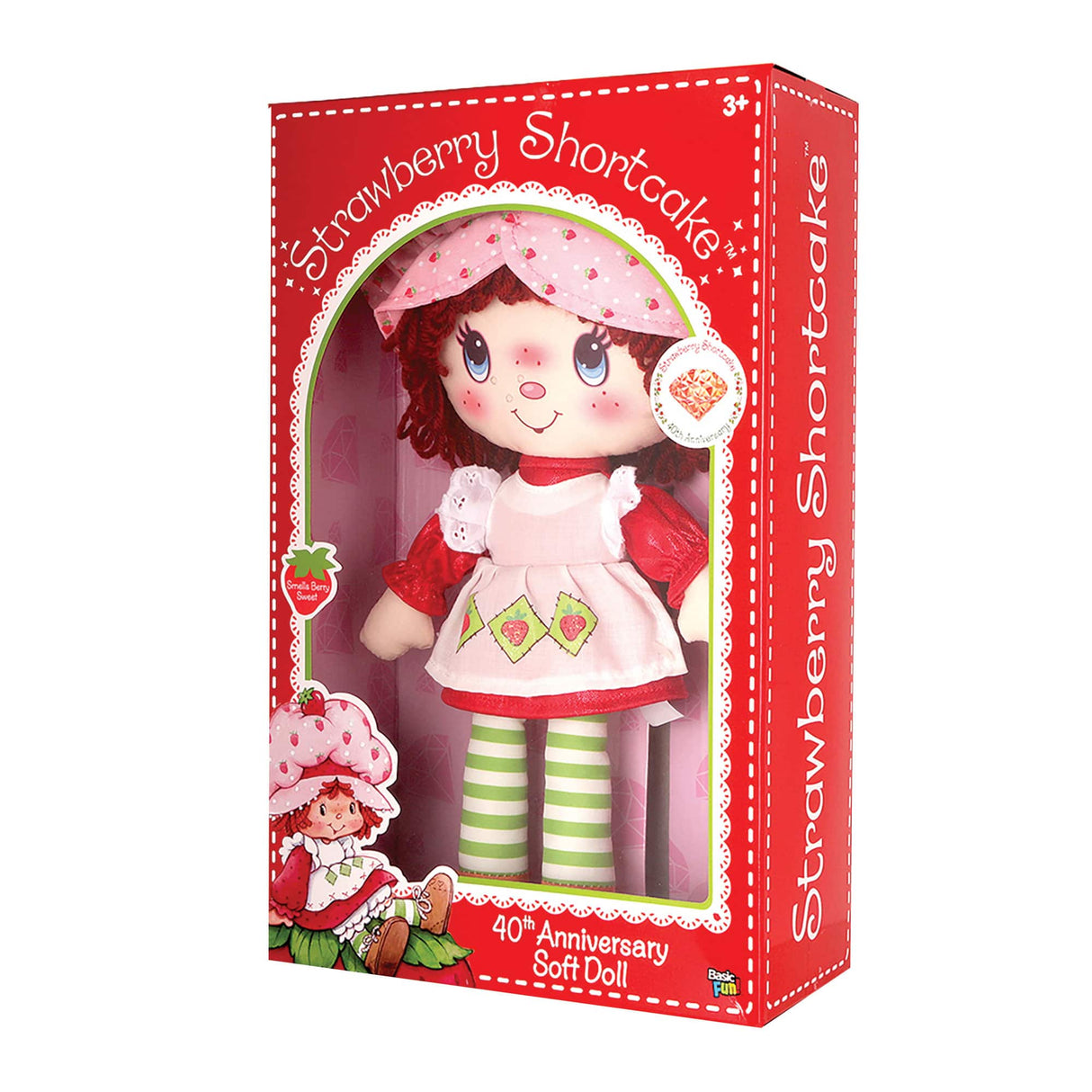 Doll in pink and red outfit, standing in a box with strawberry theme for Schylling 12320