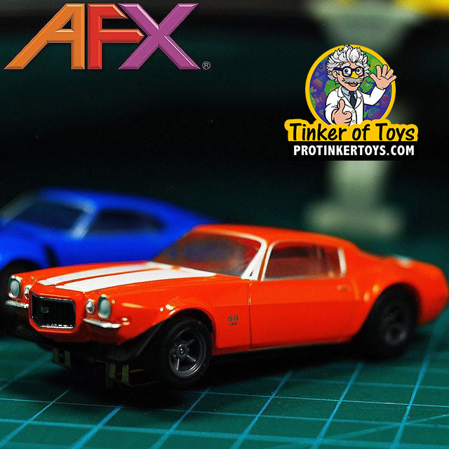 Red 1970 Chevelle 454 slot car on a green surface for AFX/Racemasters 22043