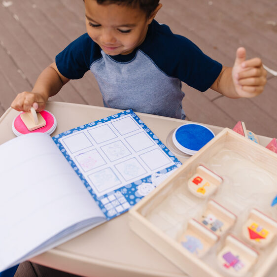 Child stamps activity set with book and stamps on a table for Melissa and Doug 33015
