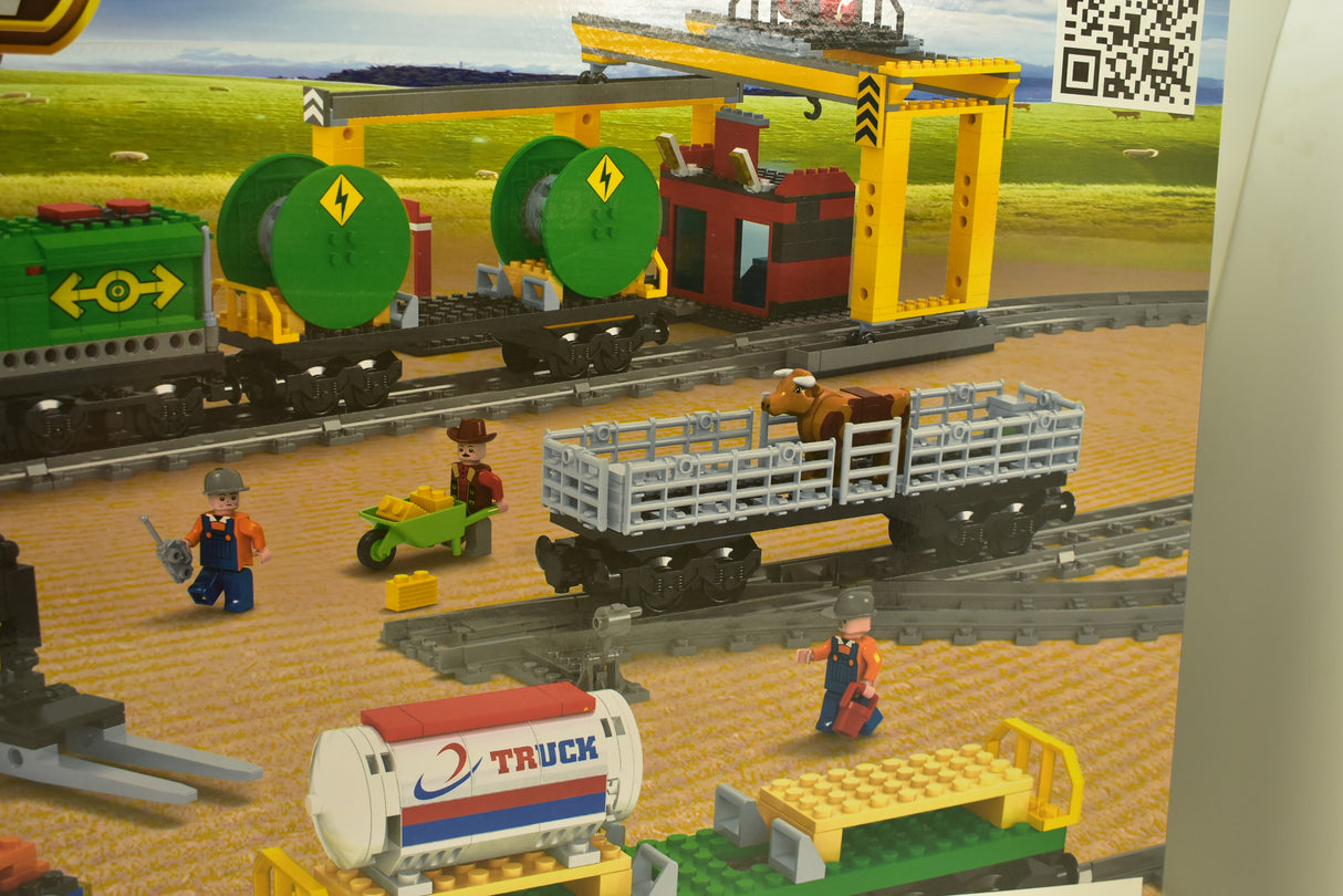 Toy train set with diesel engine, crane, and accessories on tracks for Electric Train AUS25121
