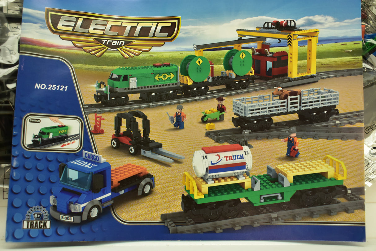 Toy train set featuring diesel freight, crane, and various accessories on tracks for Electric Train AUS25121
