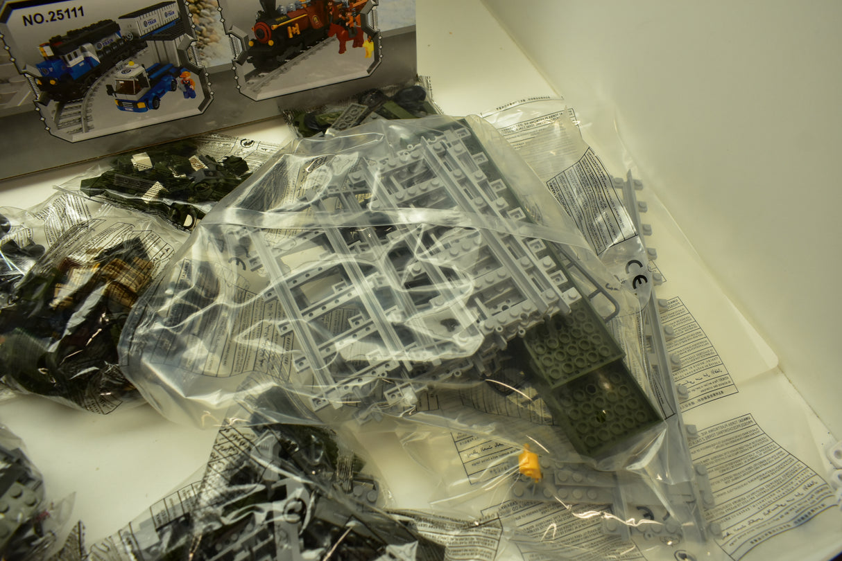 Plastic train set pieces in clear packaging, ready for assembly for Railroad Conveyance Trains AUS25003