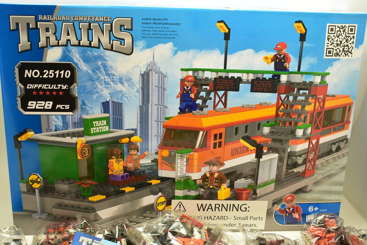 Toy train set featuring an orange locomotive, passenger cars, and station building for Railroad Conveyance Trains AUS25110