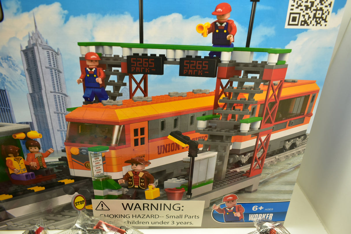 Toy train set featuring an orange diesel locomotive and station play area for Railroad Conveyance Trains AUS25110