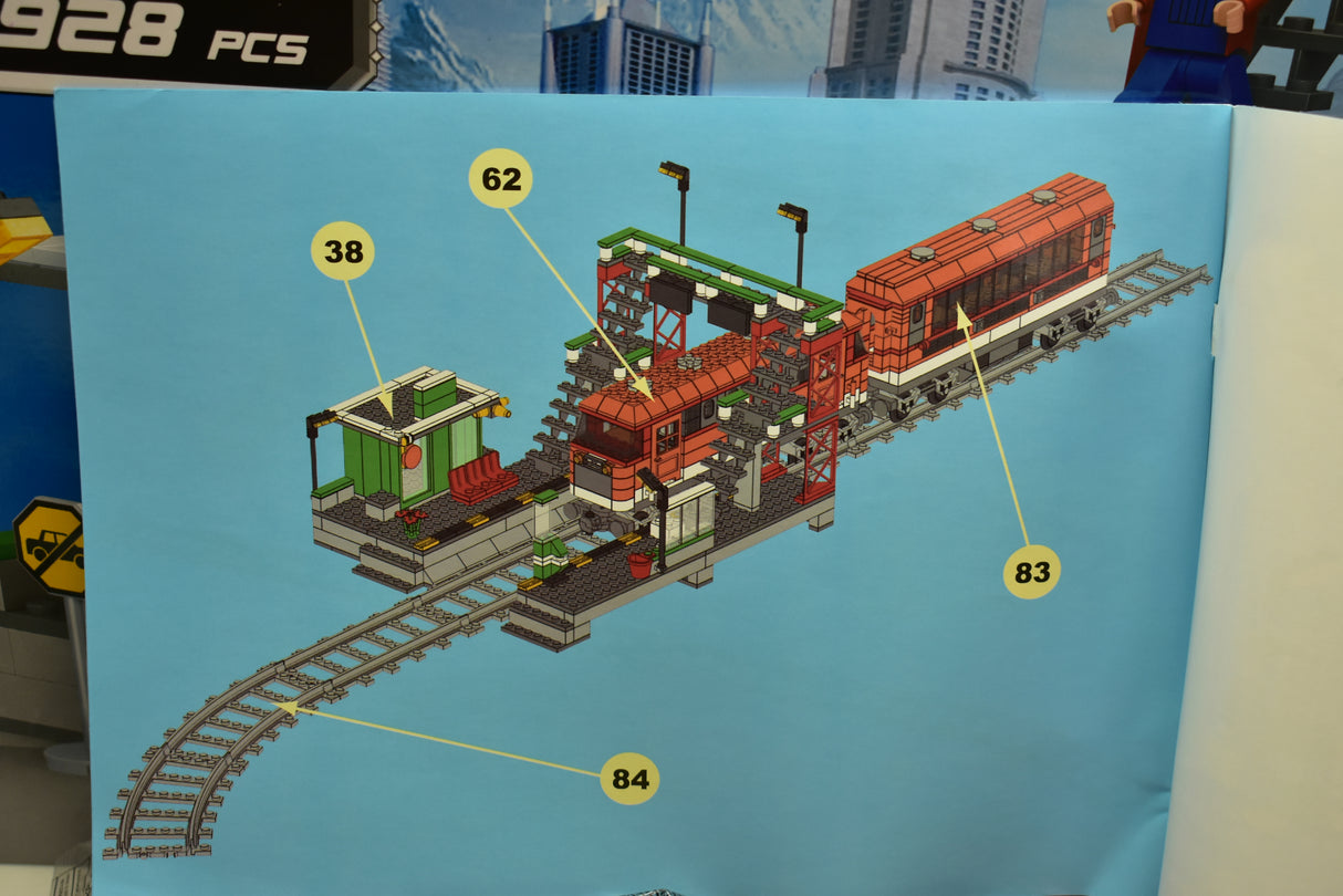 Train set with locomotive, passenger cars, and station platform on tracks for Railroad Conveyance Trains AUS25110, track view