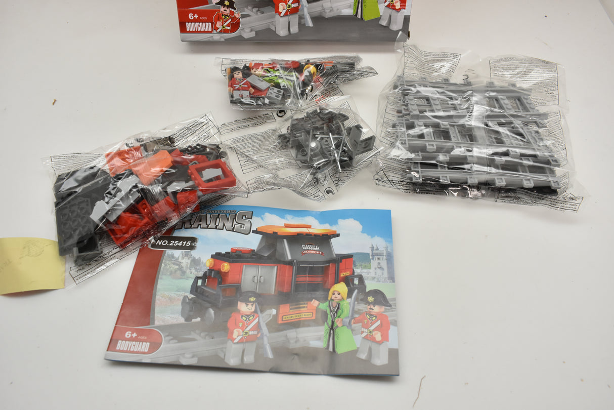Train toy set box art showing a red train engine and figures for Railroad Conveyance Trains AUS25415