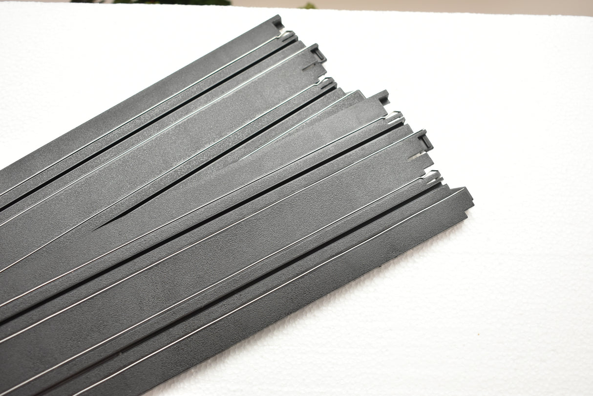 Stack of straight, gray track pieces for auto repair for Auto World H0045