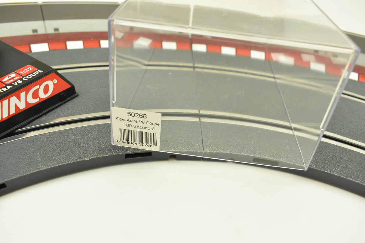 Clear plastic display case for a model car, labeled "Opel Astra V8 Coupé '60 Seconds'" for Ninco 50268