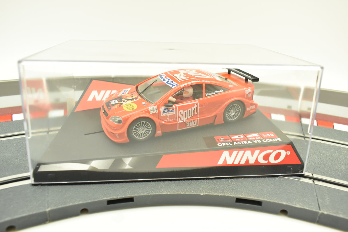 Orange Opel Astra V8 Coupe toy car on a track base for Ninco 50268