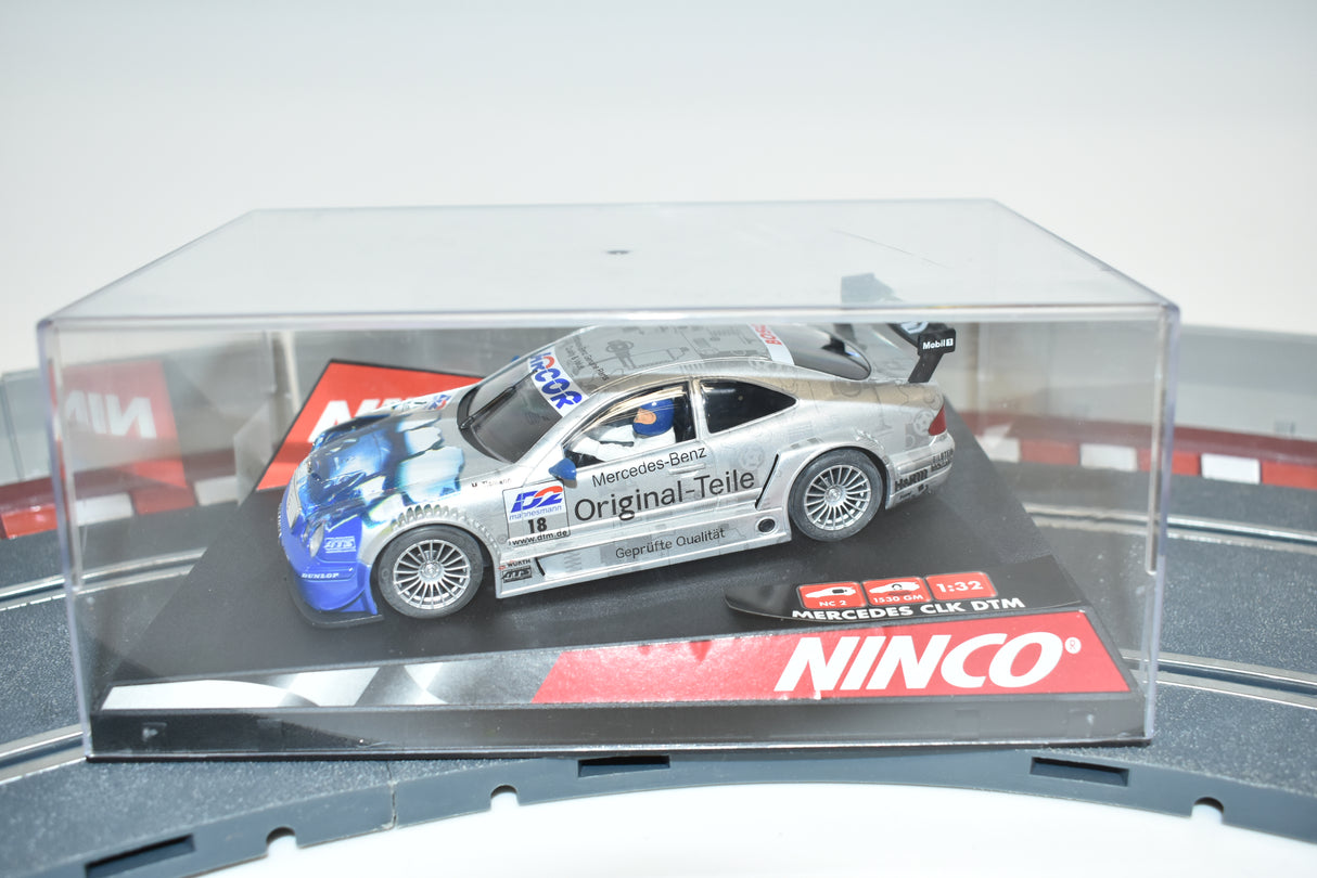 Slot car of a Mercedes CLK DTM race car in a clear display case for Ninco 50235