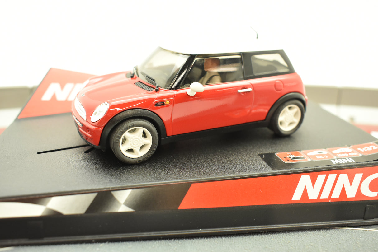 Red slot car Mini Cooper toy car on a black display base for Ninco 50275
