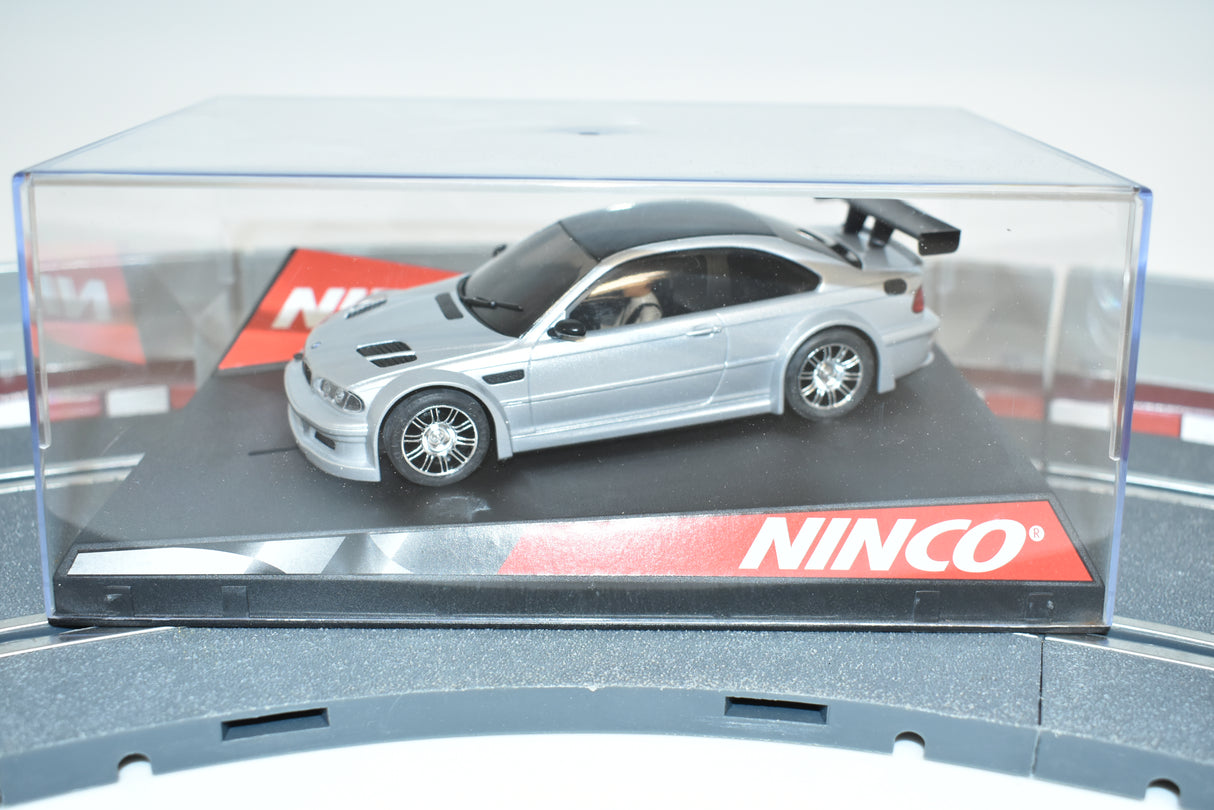 Silver and black BMW M3 GTR slot car in clear display case for Ninco 50269
