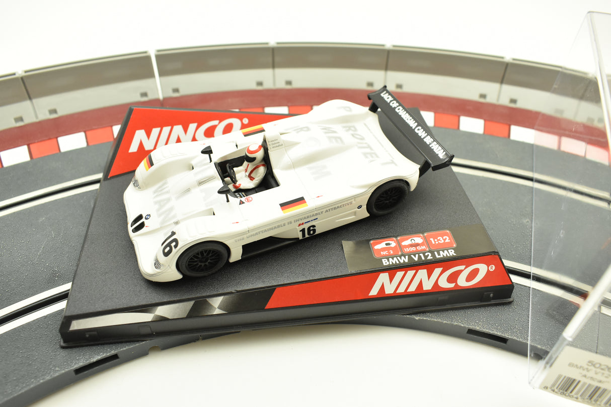 White BMW V12 LMR race car toy on a track base for REH Ninco 50262