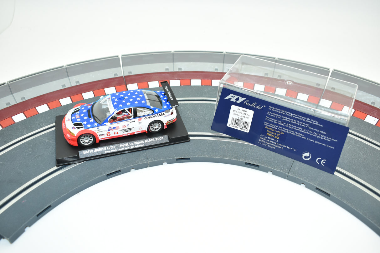 Blue and white BMW M3 GTR race car on a track section for Fly Car 88049