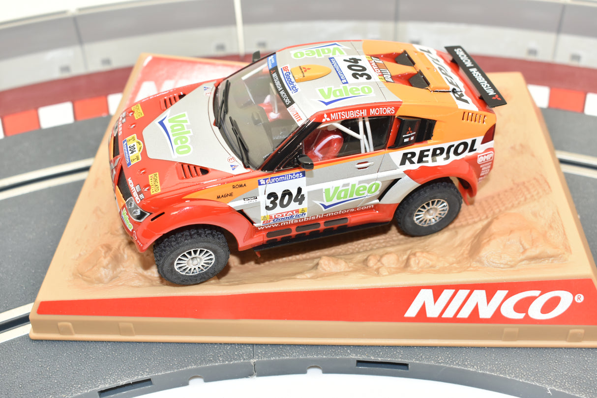 Red Mitsubishi Pajero Evo Dakar 2006 slot car on track for ZZ Expired Kim Collection 50390