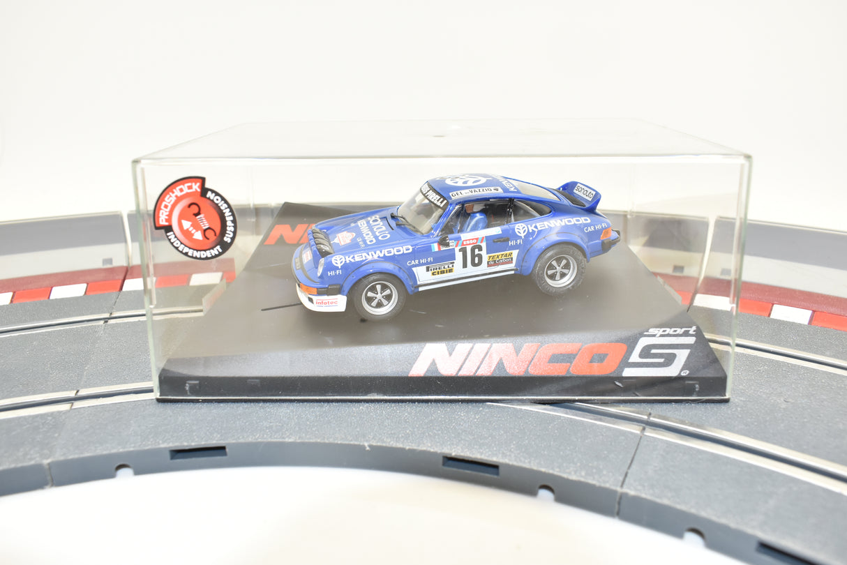 Blue Porsche 911 race car in clear display case on a track base for ZZ Expired Kim Collection 50573