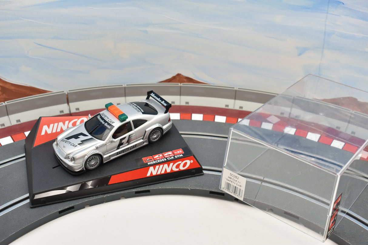 Silver Mercedes-Benz CLK F1 safety car toy car on a track display for Ninco 50282