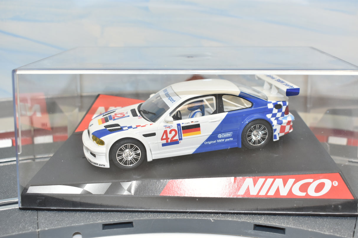 Slot car BMW M3 GTR race car, number 42, displayed in a clear case for Ninco 50270