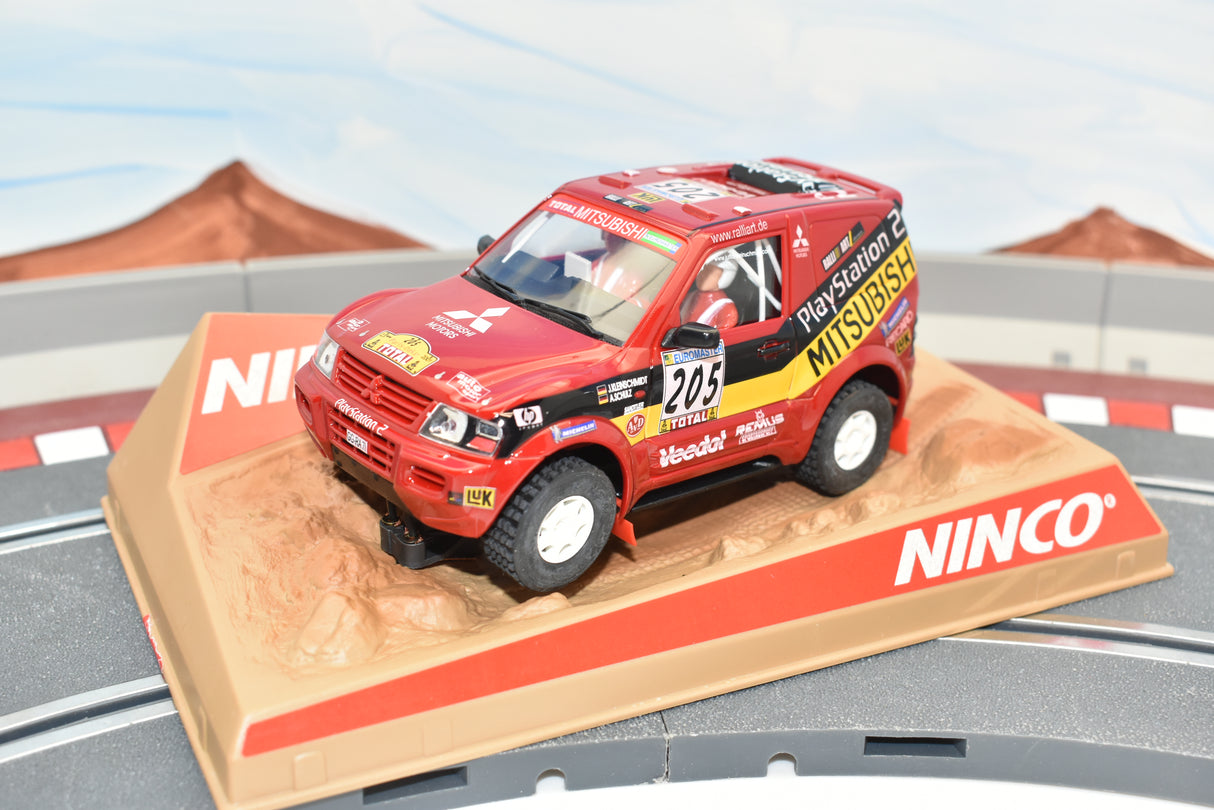 Red Mitsubishi Pajero race car on a track section for ZZ Expired Kim Collection 50305