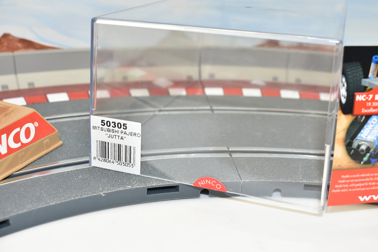 Slot car track section with a model car box labeled "50305 MITSUBISHI PAJERO 'JUTTA'" for ZZ Expired Kim Collection