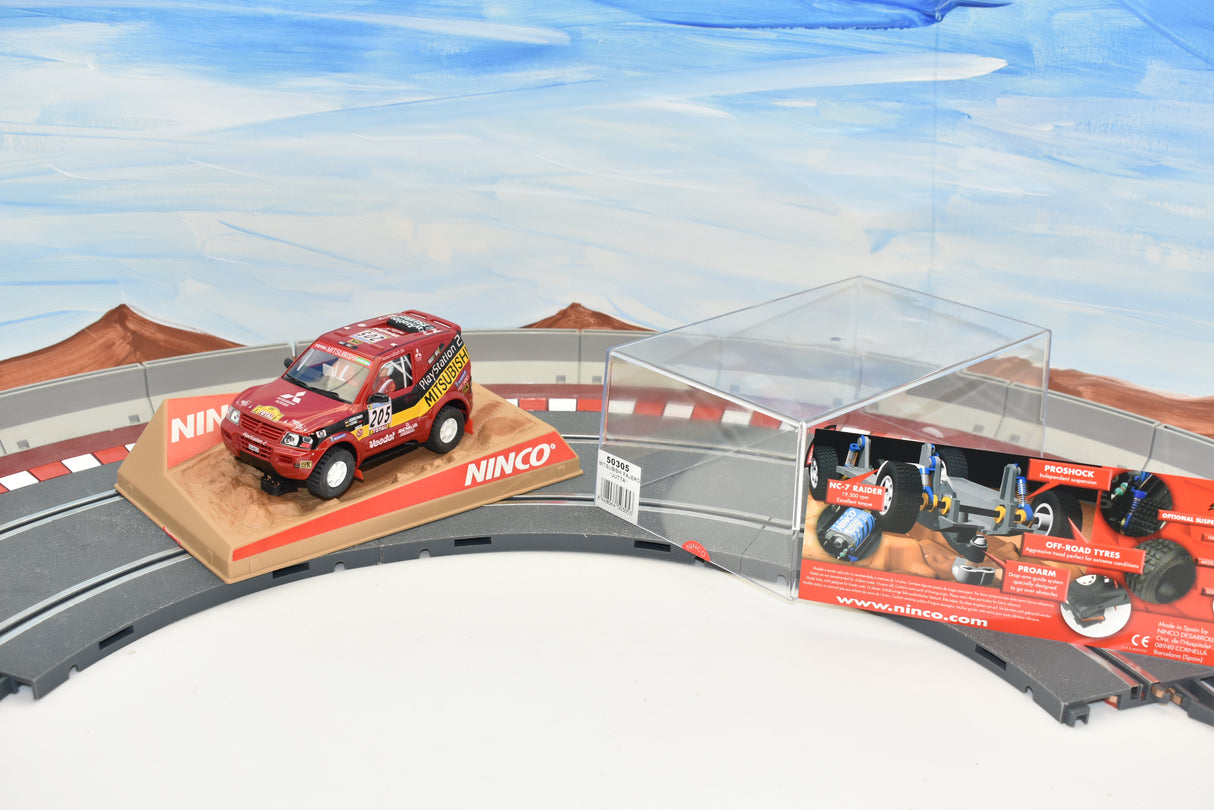 Red Mitsubishi Pajero slot car on a track set with accessories for ZZ Expired Kim Collection 50305