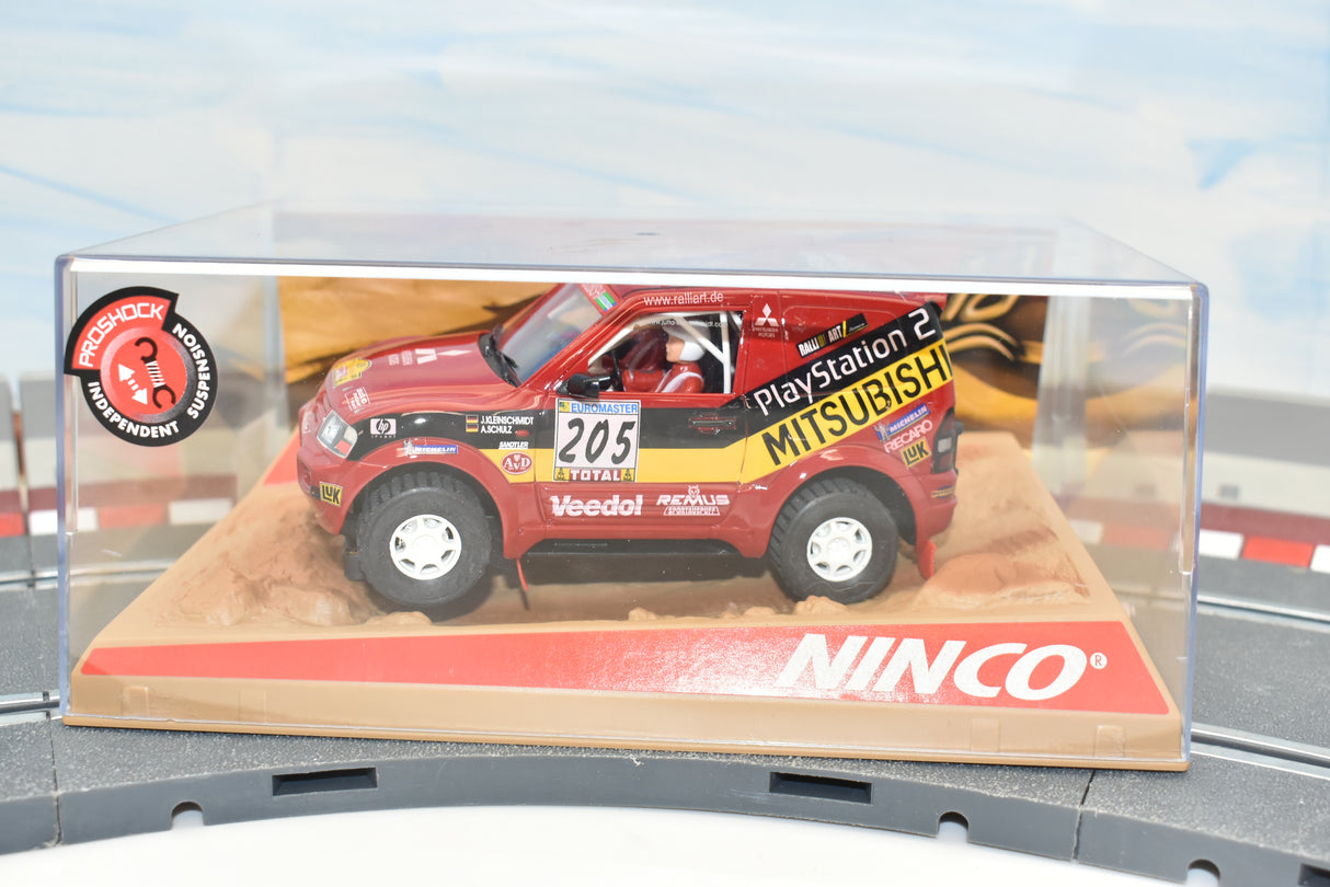 Red Mitsubishi Pajero slot car on a display base for ZZ Expired Kim Collection 50305