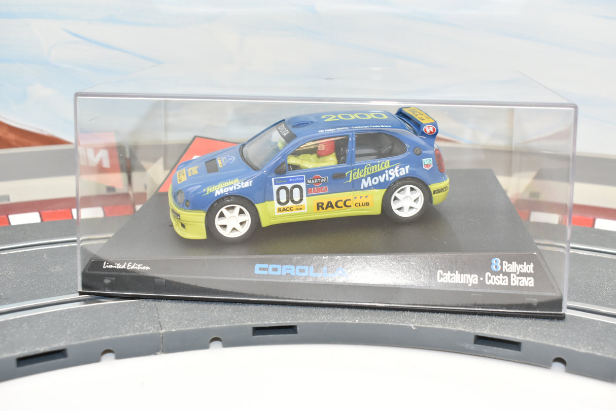 Blue and yellow 2000 Corolla race car on a track display for Ninco 50202