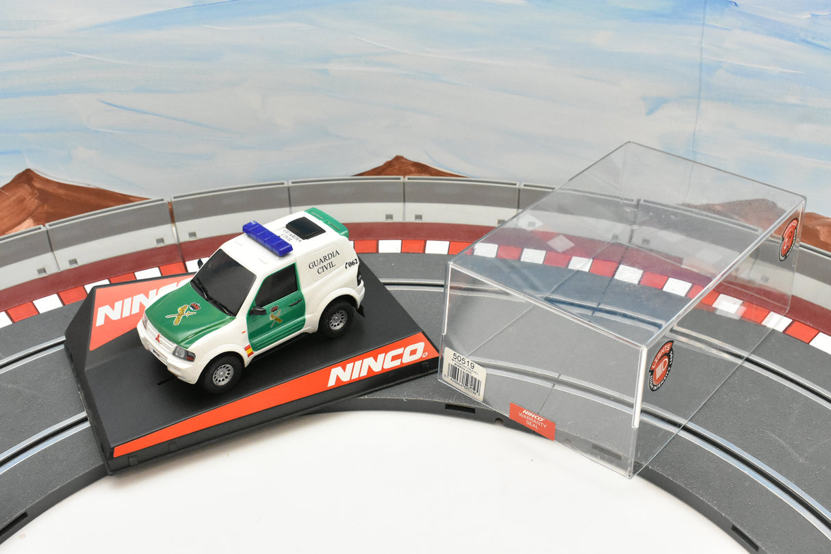 Green and white Mitsubishi Pajero Guardia Civil slot car on a track for ZZ Expired Kim Collection 50519