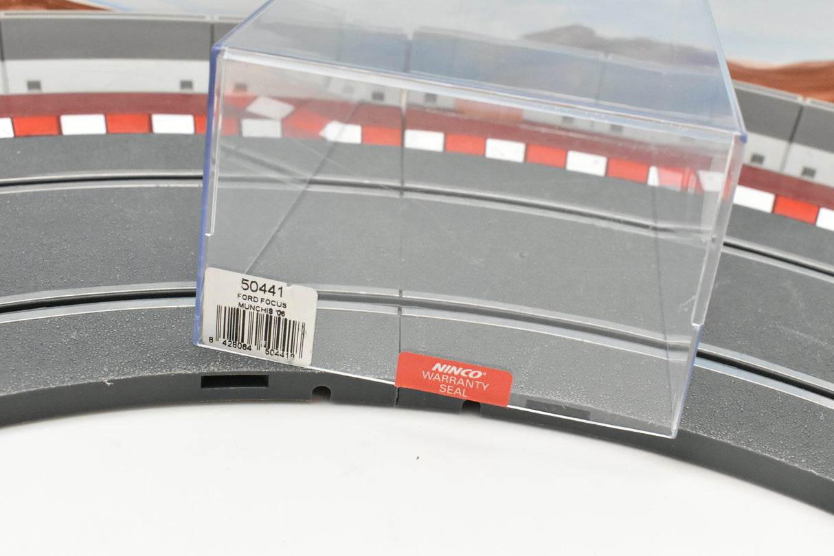 Clear plastic seal on a model car wheel, showing part number 50441 for Ninco