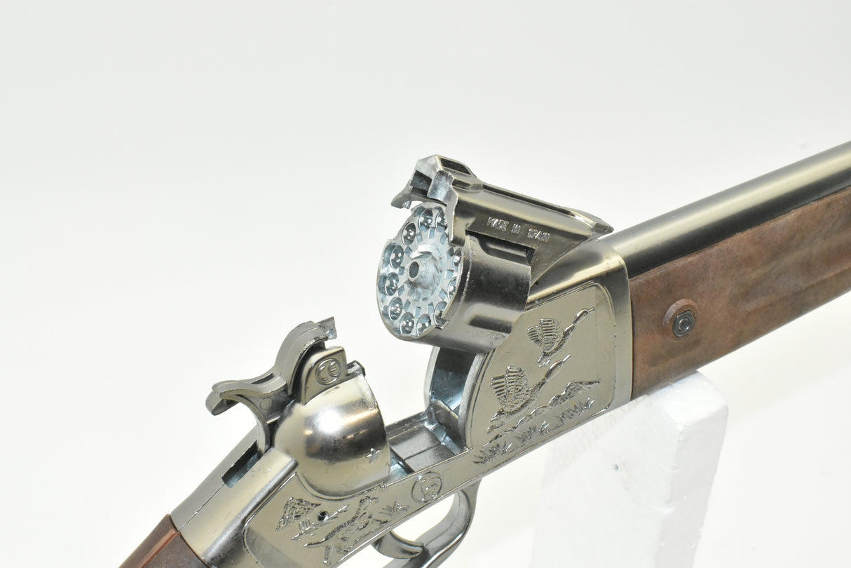 Detailed view of a toy duck rifle with engraved details and wooden stock for 4732 4732C