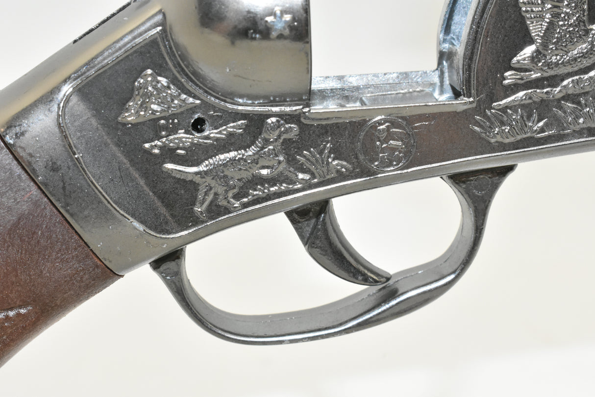 Engraved detail on a metal rifle stock, showing ducks and foliage for 4732 4732C