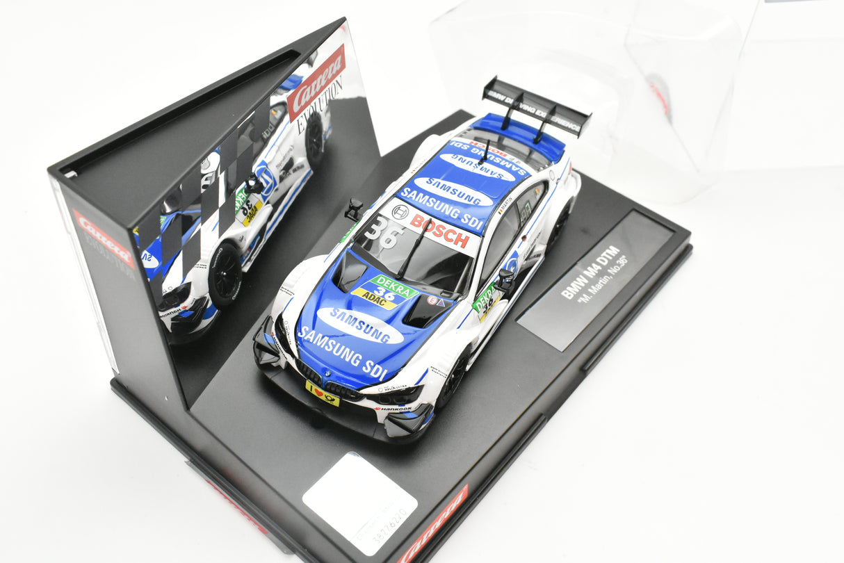 Slot car of a BMW M4 DTM race car in its box for Carrera Evolution 27571