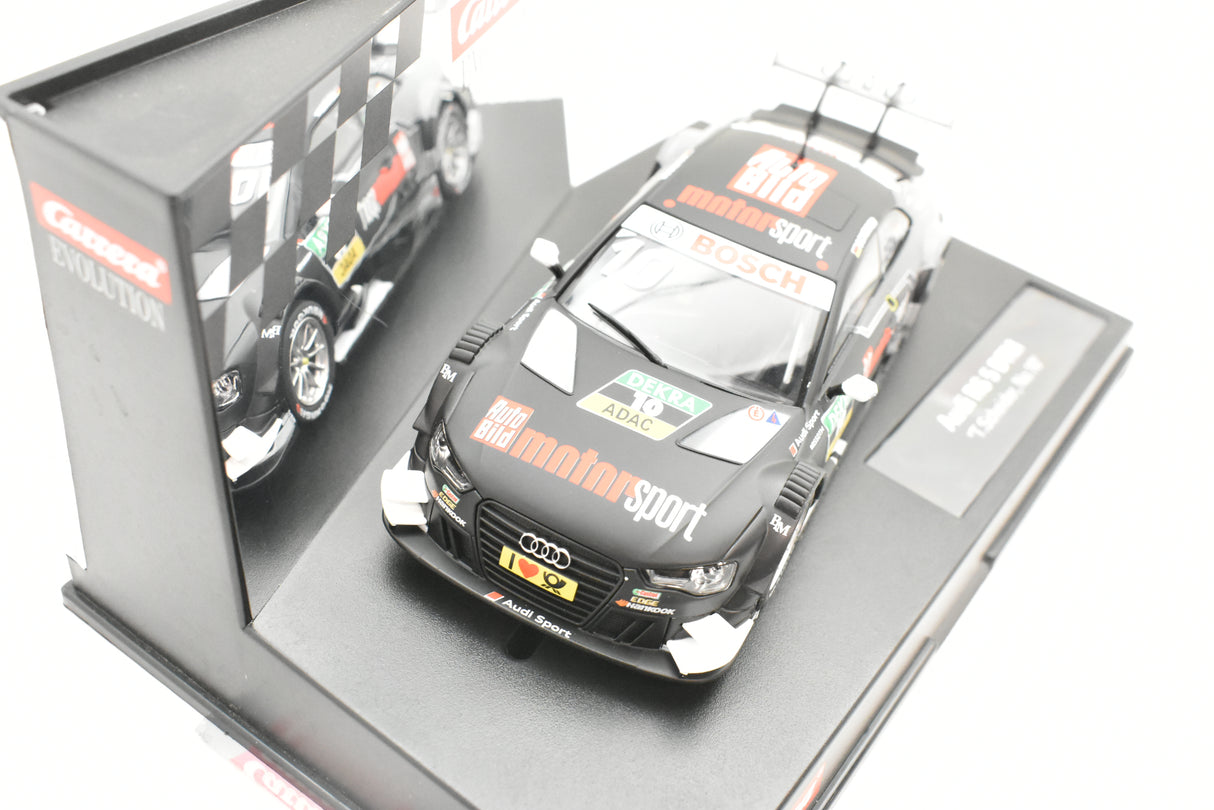 Slot car of an Audi RS 5 DTM race car in its display box for Carrera 27542